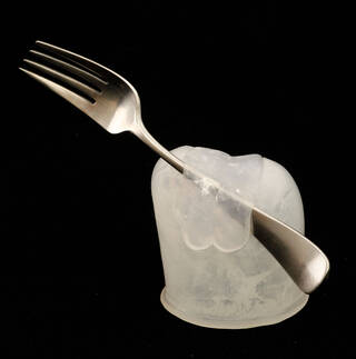 Fork suspended in a silicone cutlery holder