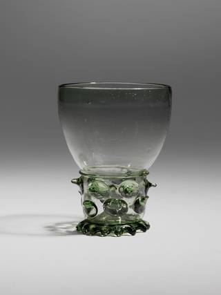 Drinking glass with applied prunts (spiky detailing) on the stem, and trailed and tooled footrim